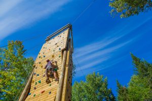 Student ascends the climbing tower